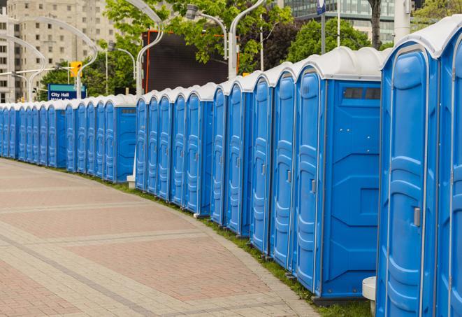 hygienic portable restrooms lined up at a beach party, ensuring guests have access to the necessary facilities while enjoying the sun and sand in Moriches